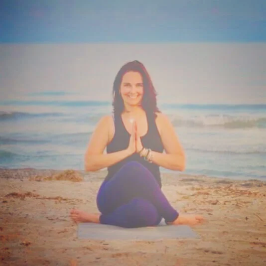 A Yoga Teacher in Cow Face Pose